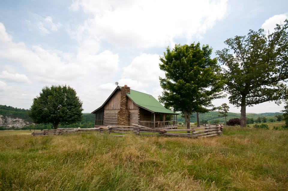 Old hand built log cabin is perfect for a family reunion or party.