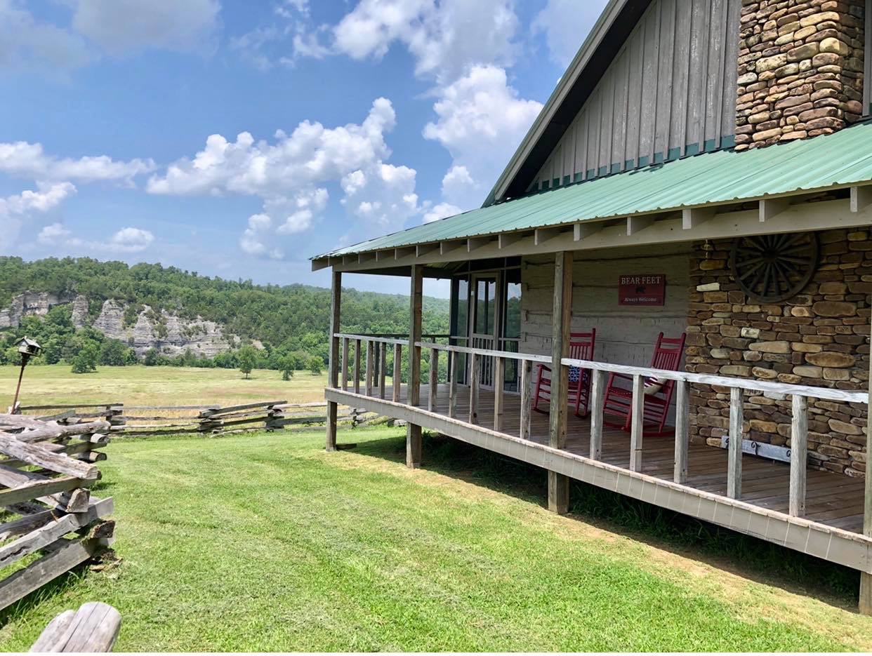 Nostalgic pioneer log cabin showcases Ozark family heritage and traditions.