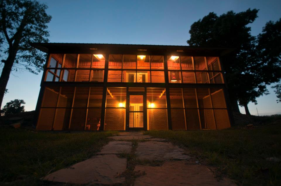 Screen porch overlooks cabin's own lake. Walk-out basements' screened porch puts you right next to lakeshore.