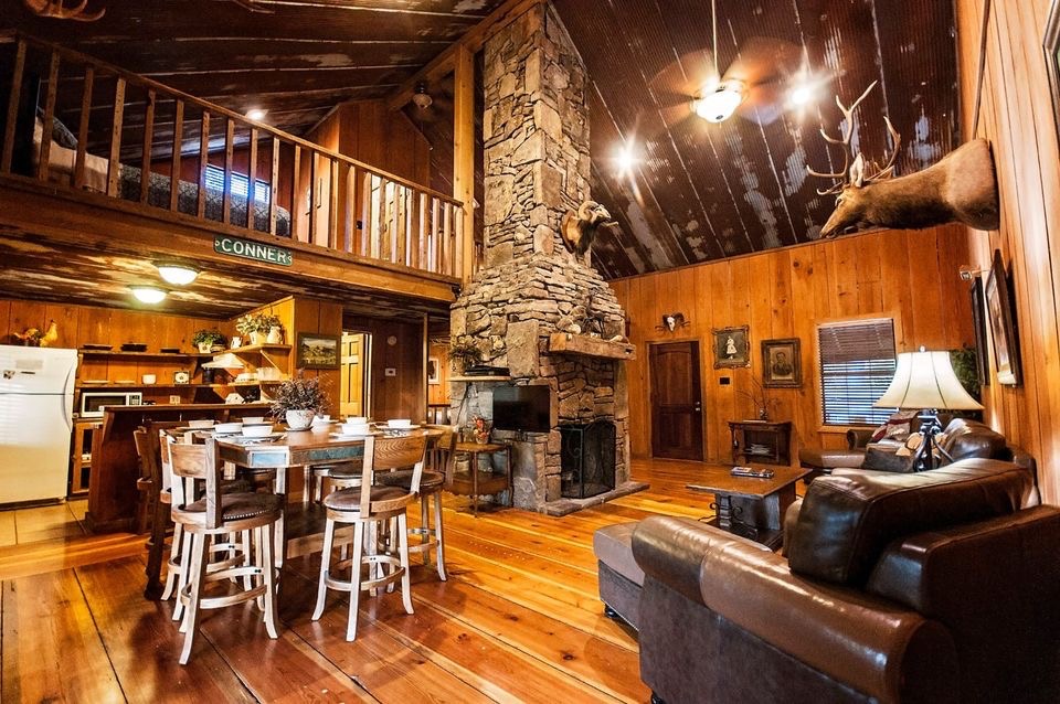 Central stone fireplace highlights this cozy Buffalo River cabin.